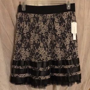 NWT lace over black skirt w/ fake leather @ bottom